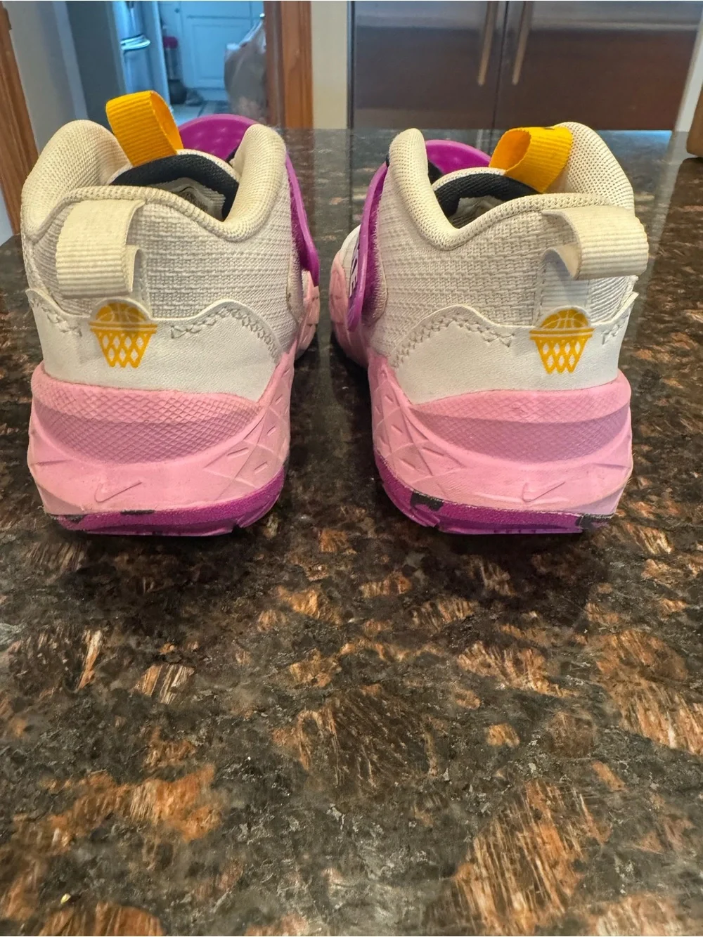 Nike Kids White basketball sneakers with Pink and Purple Accents
